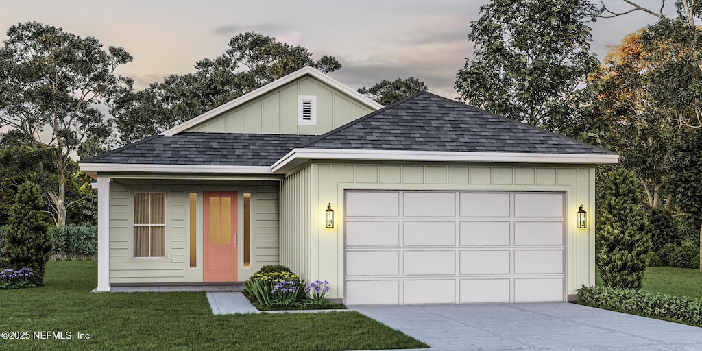 552 Seagate Ave, Neptune Beach, FL 32266 - view of front of house with a shingled roof, concrete driveway, a front lawn, board and batten siding, and an attached garage