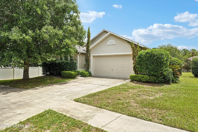 3005 Sunset Ridge Dr, Middleburg, FL 32068 - view of property hidden behind natural elements featuring concrete driveway, stucco siding, and an attached garage