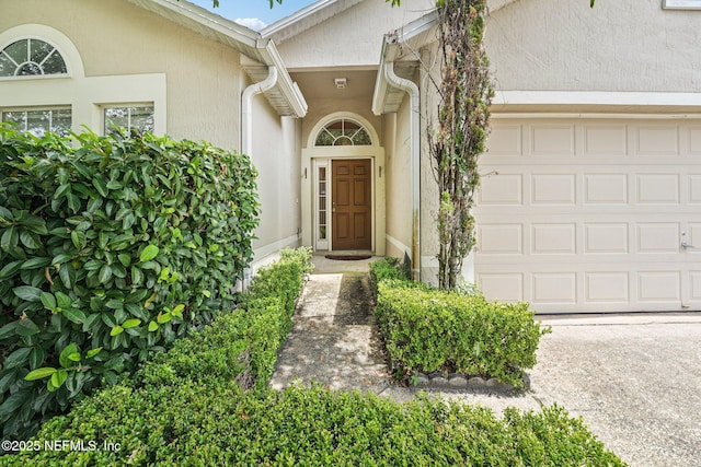 3005 Sunset Ridge Dr, Middleburg, FL 32068 - entrance to property featuring an attached garage and stucco siding