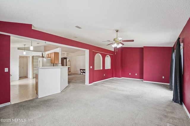 3005 Sunset Ridge Dr, Middleburg, FL 32068 - unfurnished living room featuring ceiling fan, light carpet, and a textured ceiling
