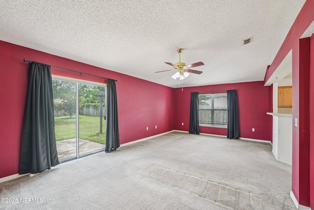 3005 Sunset Ridge Dr, Middleburg, FL 32068 - carpeted empty room featuring a ceiling fan, healthy amount of natural light, and a textured ceiling