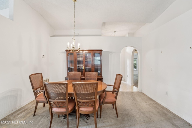 3005 Sunset Ridge Dr, Middleburg, FL 32068 - dining area with arched walkways, carpet, and a chandelier