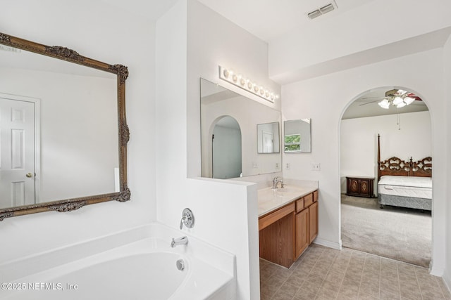 3005 Sunset Ridge Dr, Middleburg, FL 32068 - ensuite bathroom featuring vanity, a bath, and a ceiling fan