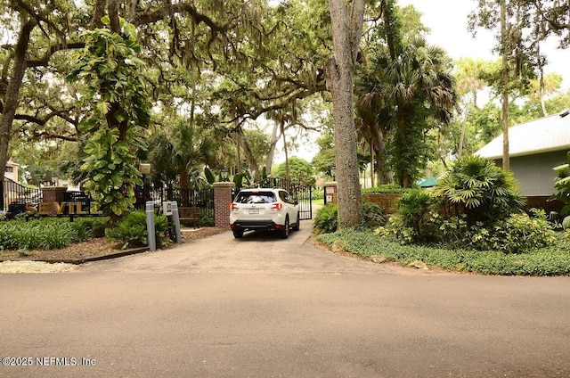 1810 Sevilla Blvd Unit 202, Atlantic Beach, FL 32233 - view of street with a gate and street lights