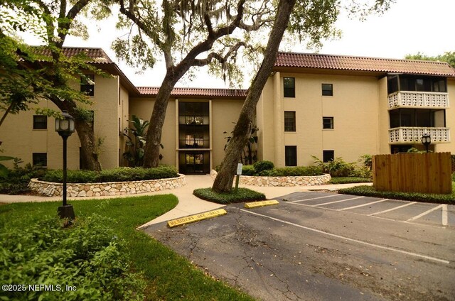 1810 Sevilla Blvd Unit 202, Atlantic Beach, FL 32233 - view of property featuring uncovered parking