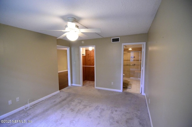 1810 Sevilla Blvd Unit 202, Atlantic Beach, FL 32233 - unfurnished bedroom featuring carpet flooring, ensuite bathroom, a spacious closet, and ceiling fan
