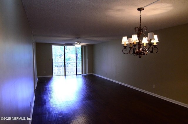1810 Sevilla Blvd Unit 202, Atlantic Beach, FL 32233 - spare room featuring dark wood-style flooring, a ceiling fan, a chandelier, and a wall of windows