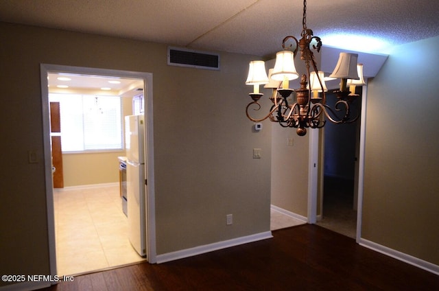1810 Sevilla Blvd Unit 202, Atlantic Beach, FL 32233 - unfurnished dining area with a chandelier and wood finished floors