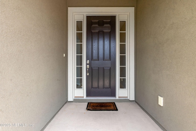 94032 Woodbrier Cir, Fernandina Beach, FL 32034 - view of exterior entry with stucco siding