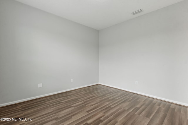 94032 Woodbrier Cir, Fernandina Beach, FL 32034 - spare room with wood finished floors and baseboards