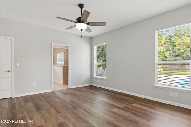 94032 Woodbrier Cir, Fernandina Beach, FL 32034 - empty room with wood finished floors and a ceiling fan