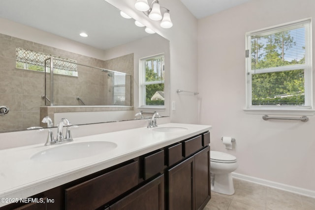 94032 Woodbrier Cir, Fernandina Beach, FL 32034 - full bathroom featuring double vanity, tiled shower, and tile patterned flooring