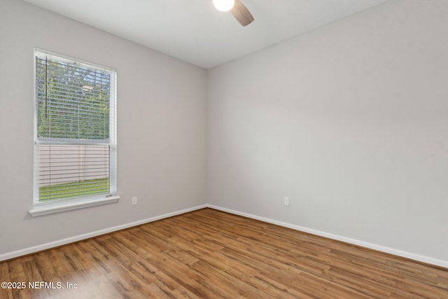 94032 Woodbrier Cir, Fernandina Beach, FL 32034 - empty room featuring wood finished floors and ceiling fan