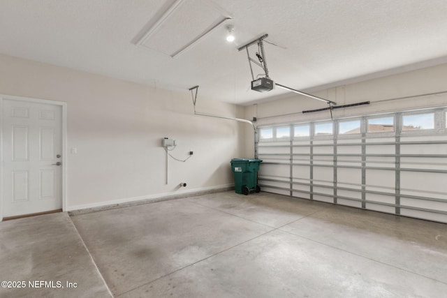 94032 Woodbrier Cir, Fernandina Beach, FL 32034 - garage with a garage door opener and baseboards