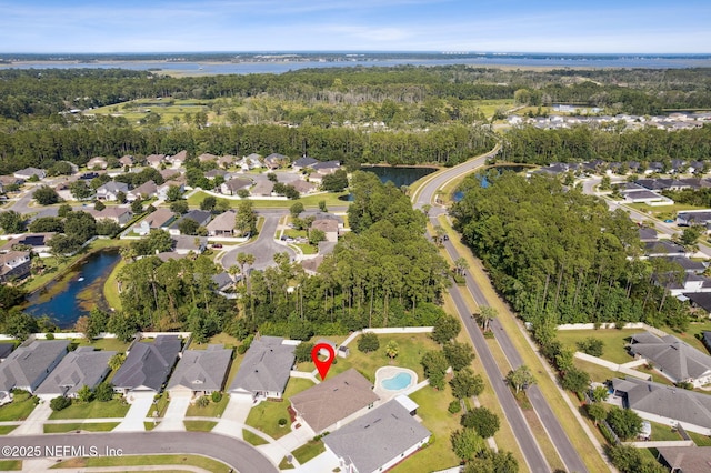 94032 Woodbrier Cir, Fernandina Beach, FL 32034 - aerial view of property's location featuring a large body of water and nearby suburban area