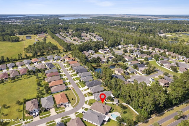 94032 Woodbrier Cir, Fernandina Beach, FL 32034 - aerial view of property and surrounding area with nearby suburban area and a large body of water