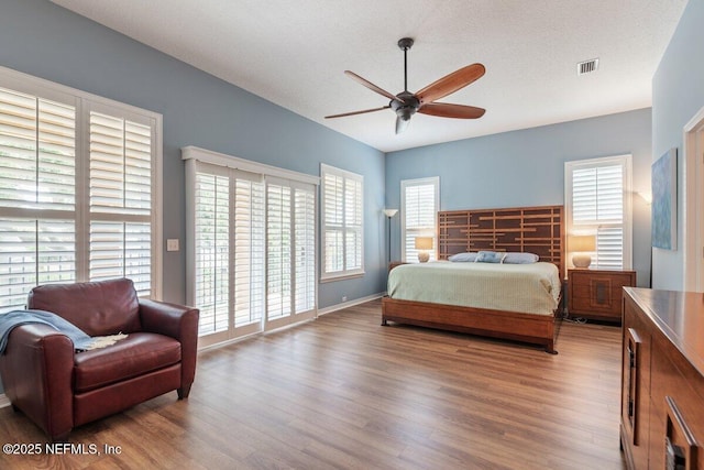 2348 Seminole Reach Ct, Atlantic Beach, FL 32233 - bedroom featuring access to outside, wood finished floors, and ceiling fan