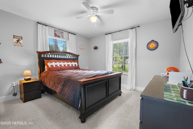 5263 Ellen Ct, Saint Augustine, FL 32086 - bedroom with multiple windows, light colored carpet, and a ceiling fan