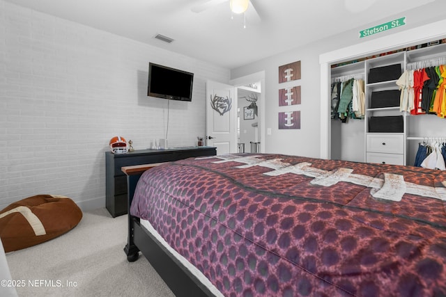 5263 Ellen Ct, Saint Augustine, FL 32086 - carpeted bedroom featuring a closet, ceiling fan, and brick wall
