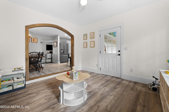 5263 Ellen Ct, Saint Augustine, FL 32086 - entrance foyer with arched walkways, wood finished floors, and a ceiling fan