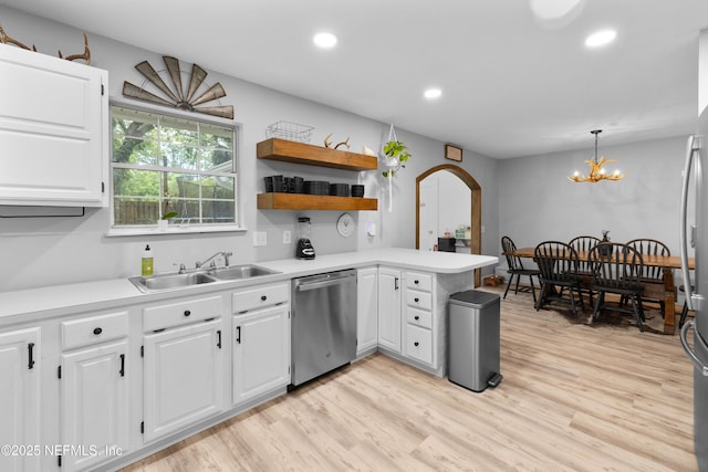 5263 Ellen Ct, Saint Augustine, FL 32086 - kitchen featuring stainless steel dishwasher, a peninsula, recessed lighting, white cabinetry, and light countertops