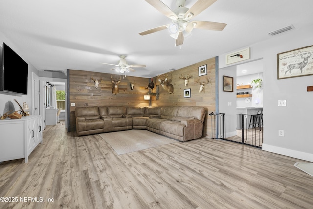5263 Ellen Ct, Saint Augustine, FL 32086 - unfurnished living room with a ceiling fan, wood walls, and wood finished floors