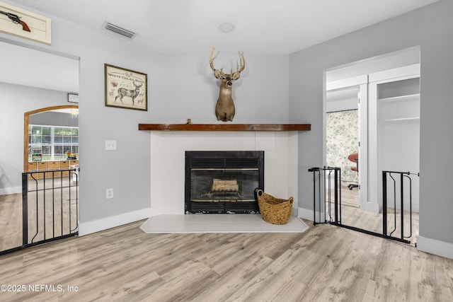 5263 Ellen Ct, Saint Augustine, FL 32086 - living room with wood finished floors and a tiled fireplace