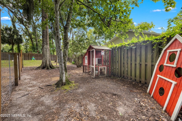 5263 Ellen Ct, Saint Augustine, FL 32086 - fenced backyard with exterior structure and an outdoor structure