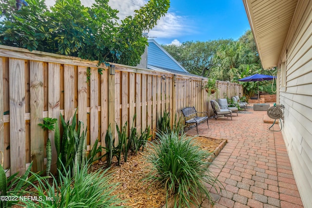 315 20th St, Atlantic Beach, FL 32233 - fenced backyard with a patio