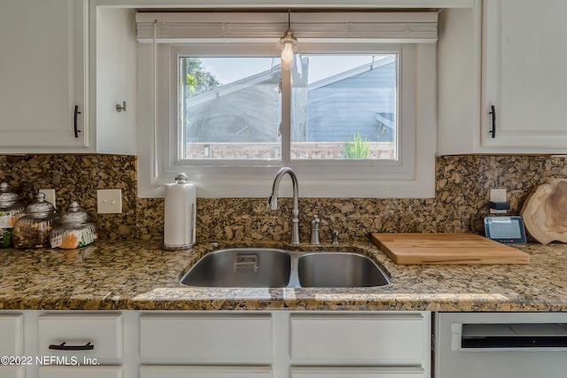 315 20th St, Atlantic Beach, FL 32233 - kitchen with dishwashing machine, white cabinets, tasteful backsplash, and stone counters