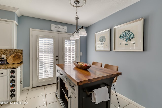 315 20th St, Atlantic Beach, FL 32233 - dining space featuring light tile patterned floors and baseboards