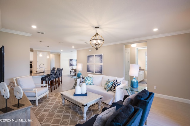 364 Higgins Loop, Saint Augustine, FL 32092 - living room with recessed lighting, wood finished floors, ornamental molding, and a chandelier