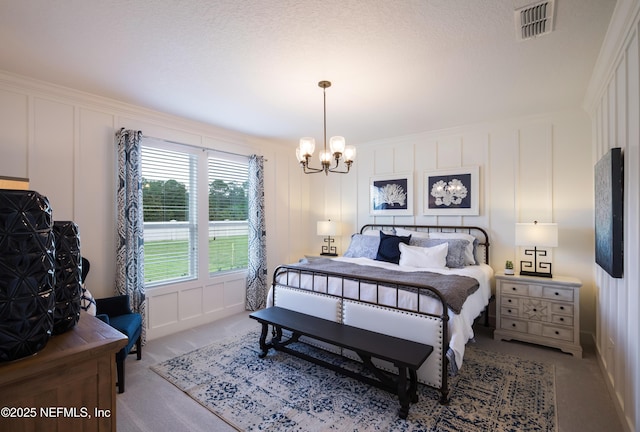 364 Higgins Loop, Saint Augustine, FL 32092 - carpeted bedroom with a decorative wall and a chandelier