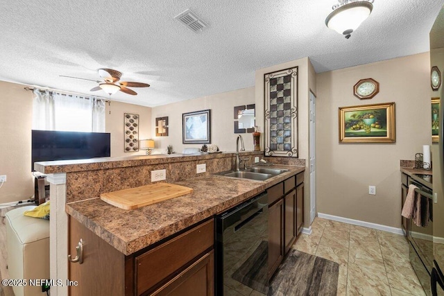 2548 Haywood Estates Ln, Jacksonville, FL 32233 - kitchen featuring a peninsula, dishwashing machine, a ceiling fan, a textured ceiling, and dark countertops