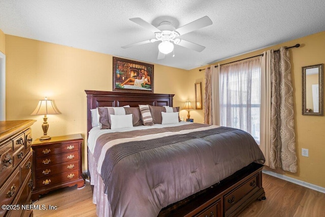 2548 Haywood Estates Ln, Jacksonville, FL 32233 - bedroom featuring wood finished floors, ceiling fan, and a textured ceiling