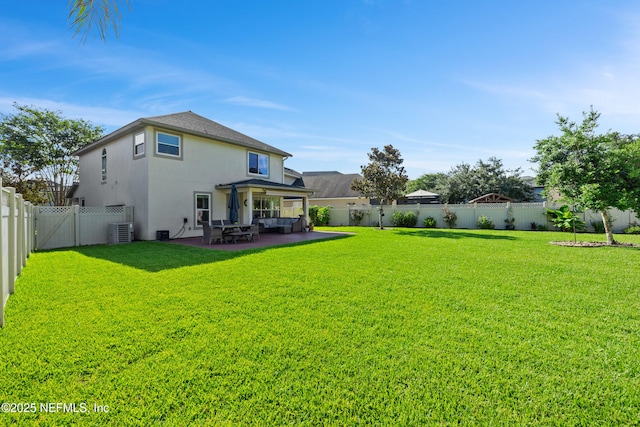 1563 Tawny Marsh Ct, Saint Augustine, FL 32092 - back of house featuring a fenced backyard, stucco siding, and a patio area