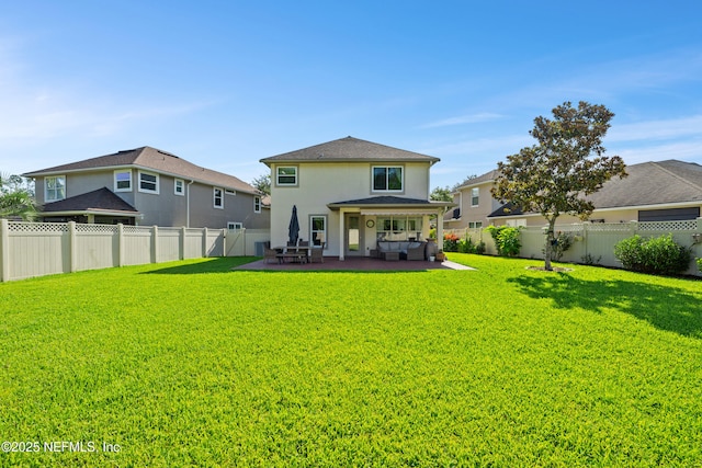 1563 Tawny Marsh Ct, Saint Augustine, FL 32092 - rear view of house with stucco siding, a fenced backyard, outdoor lounge area, and a patio area