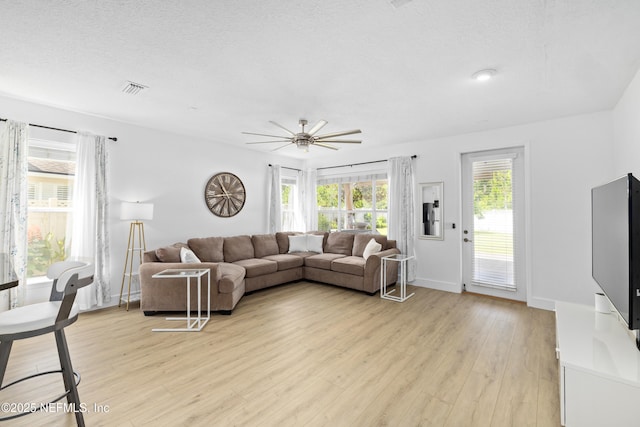 1563 Tawny Marsh Ct, Saint Augustine, FL 32092 - living room with ceiling fan and light wood-style floors