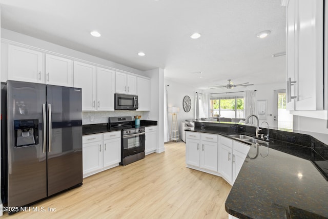 1563 Tawny Marsh Ct, Saint Augustine, FL 32092 - kitchen featuring stainless steel appliances, white cabinetry, ceiling fan, recessed lighting, and light wood-style flooring