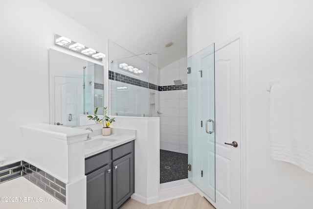 1563 Tawny Marsh Ct, Saint Augustine, FL 32092 - bathroom featuring vanity, a stall shower, and vaulted ceiling