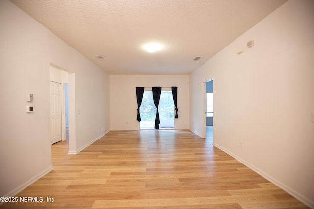3600 Lenin Peak Ct Unit 8, Jacksonville, FL 32210 - unfurnished room featuring light wood-style flooring and a textured ceiling