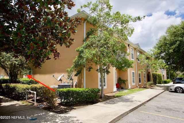 3600 Lenin Peak Ct Unit 8, Jacksonville, FL 32210 - view of building exterior featuring uncovered parking
