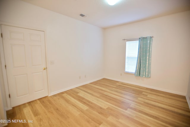 3600 Lenin Peak Ct Unit 8, Jacksonville, FL 32210 - spare room featuring light wood-style floors and baseboards