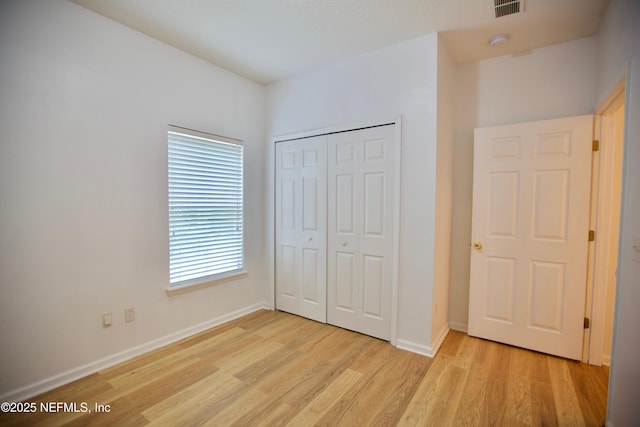 3600 Lenin Peak Ct Unit 8, Jacksonville, FL 32210 - unfurnished bedroom featuring light wood-style floors and a closet