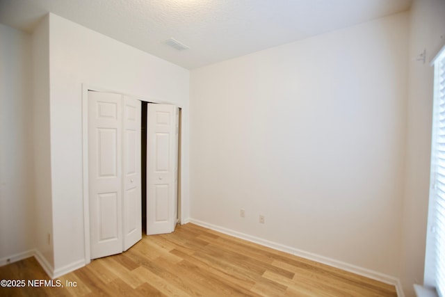 3600 Lenin Peak Ct Unit 8, Jacksonville, FL 32210 - unfurnished bedroom with light wood-style floors and a closet