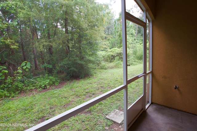 3600 Lenin Peak Ct Unit 8, Jacksonville, FL 32210 - unfurnished sunroom with plenty of natural light and a forest view