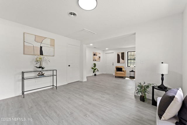 6285 Spring Forest Cir, Jacksonville, FL 32216 - living room with attic access, wood finished floors, and recessed lighting