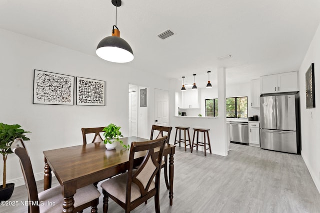 6285 Spring Forest Cir, Jacksonville, FL 32216 - dining space featuring light wood-style flooring and baseboards