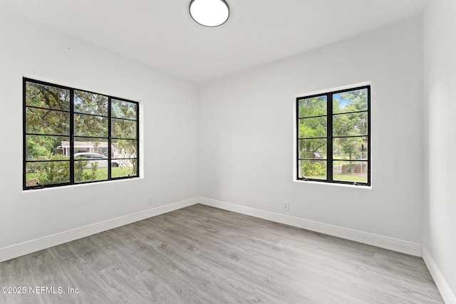 6285 Spring Forest Cir, Jacksonville, FL 32216 - spare room with baseboards and wood finished floors