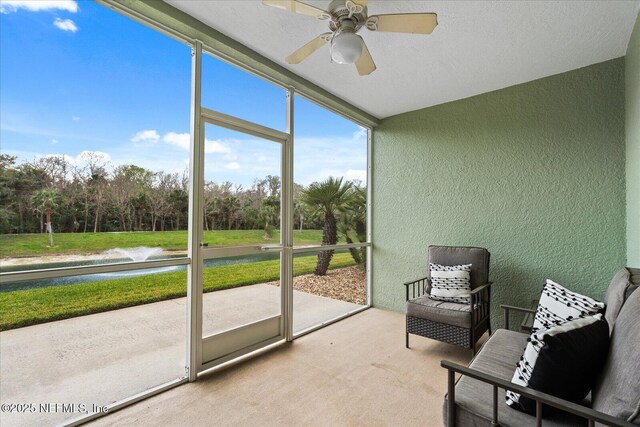 1200 Canopy Walk Ln Unit 1212, Palm Coast, FL 32137 - sunroom featuring ceiling fan and view of scattered trees
